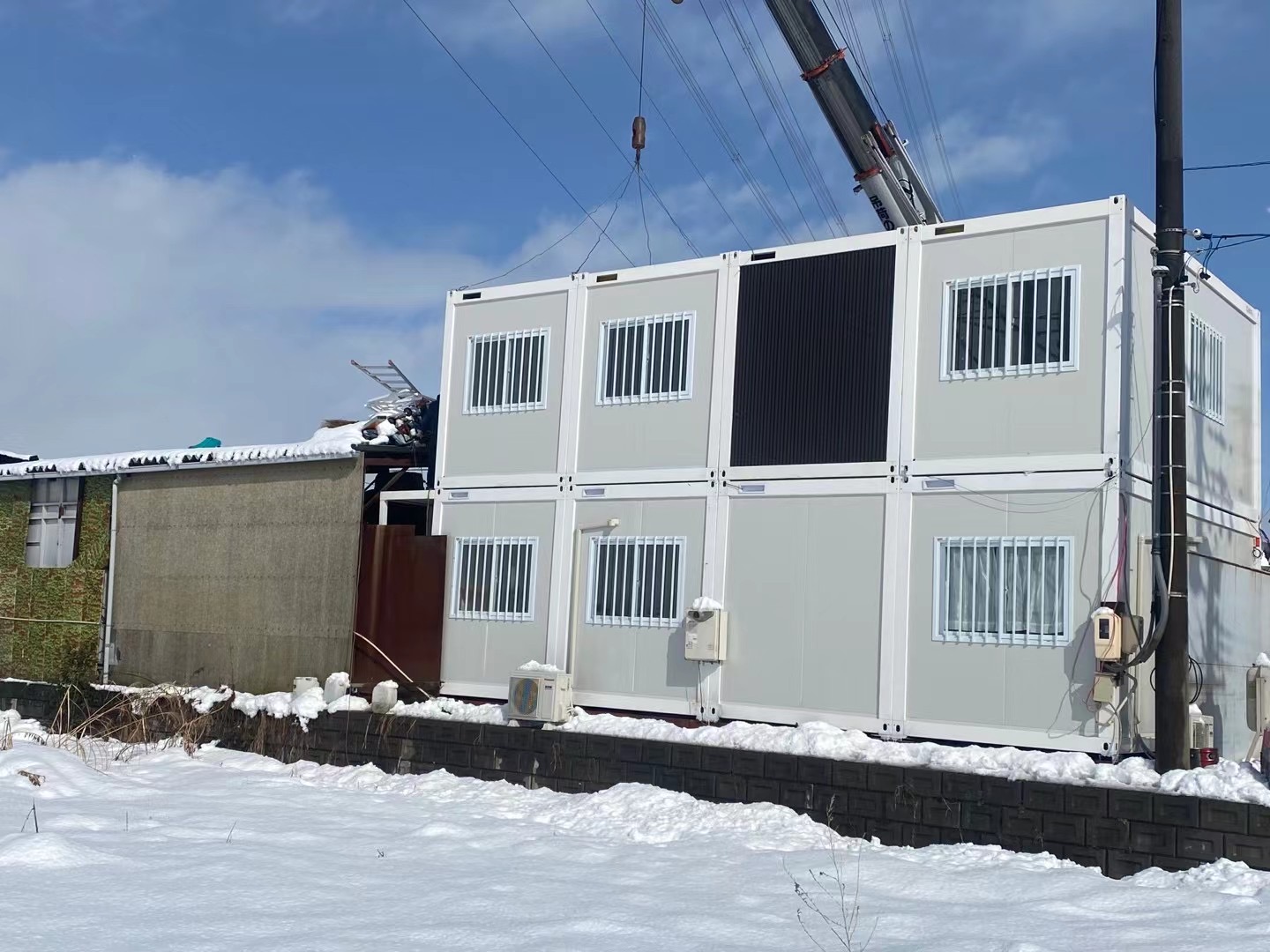 Two-storey modular building in a snowy setting
