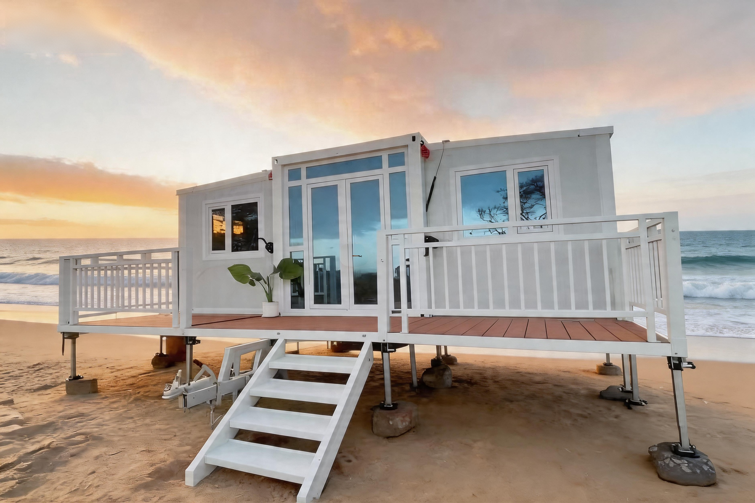 White container home with a terrace by the sea