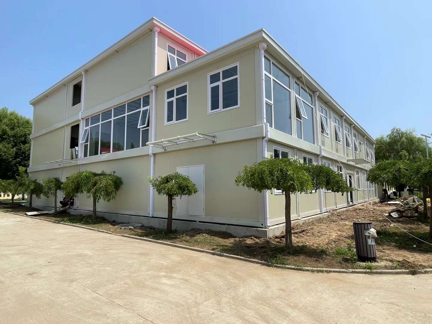 Multi-storey modular school building with large windows