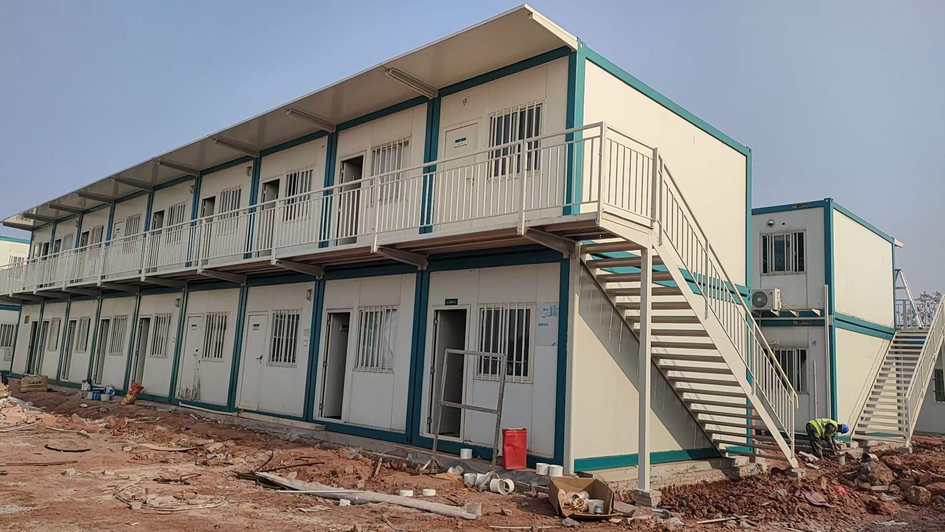 Two-storey modular worker dormitories with external walkways and stairs